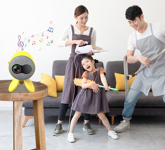 A happy family cleaning together with a vibrant YG220 HD 1080P LED Projector Support in the foreground, enjoying music and fun.